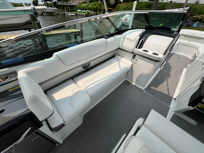 4th Quarter Yacht Photos Pics 2016 Formula 310 Bowrider interior with white seating and sleek design.