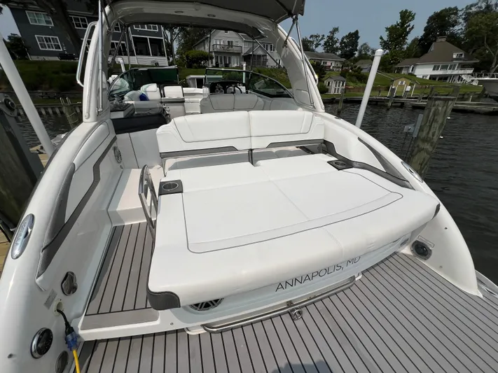 4th Quarter Yacht Photos Pics 2016 Formula 310 Bowrider boat docked, featuring spacious seating and sleek design.