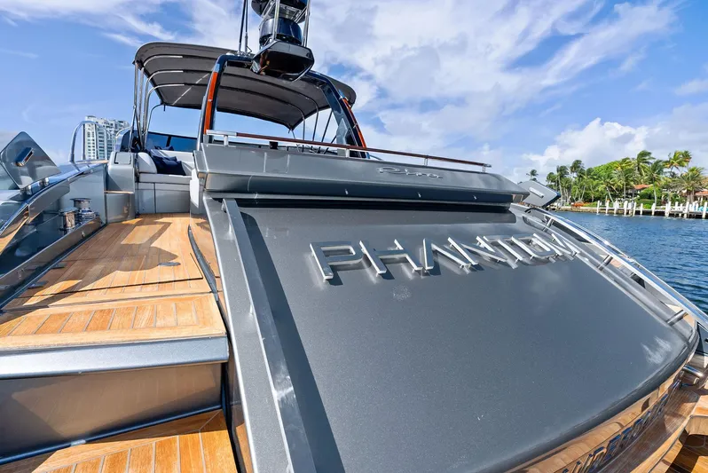 Phantom Yacht Photos Pics 2019 Riva 56 Rivale luxury yacht "Phantom" with sleek design and wooden deck.