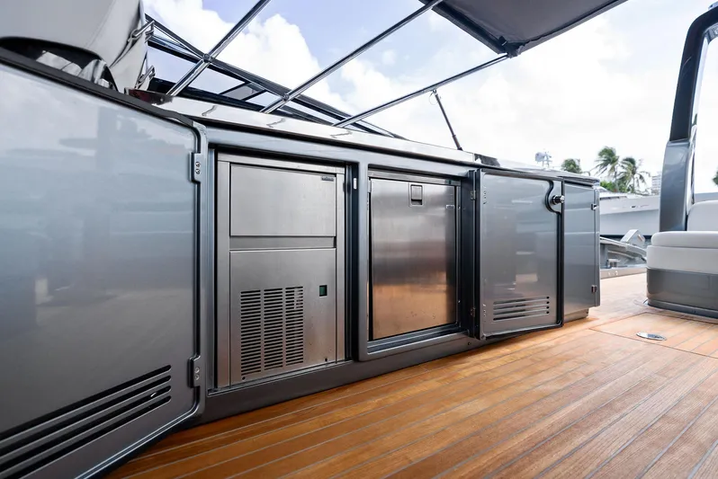 Phantom Yacht Photos Pics 2019 Riva 56 Rivale yacht deck with stainless steel cabinets and wooden flooring.