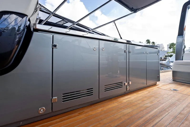 Phantom Yacht Photos Pics 2019 Riva 56 Rivale yacht deck with sleek cabinetry and wooden flooring.