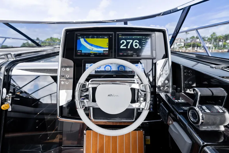 Phantom Yacht Photos Pics Cockpit of 2019 Riva 56 Rivale yacht with modern navigation displays and controls.