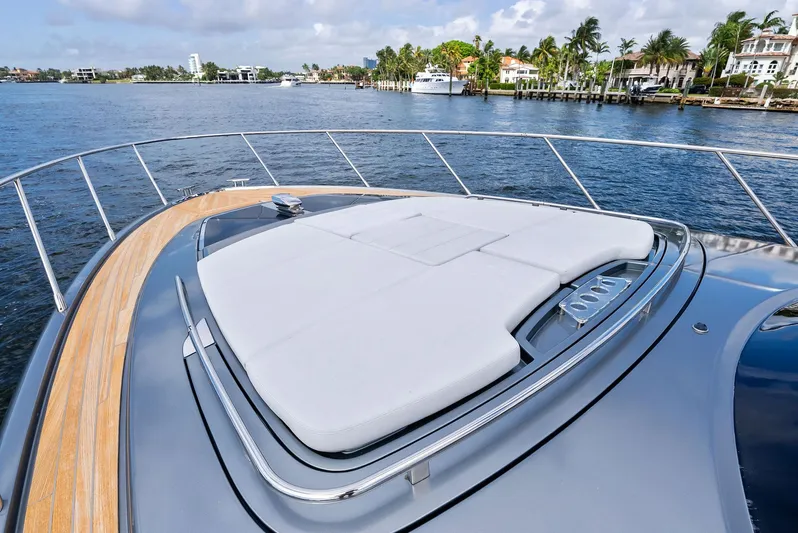 Phantom Yacht Photos Pics 2019 Riva 56 Rivale yacht with sleek deck design on calm waters.