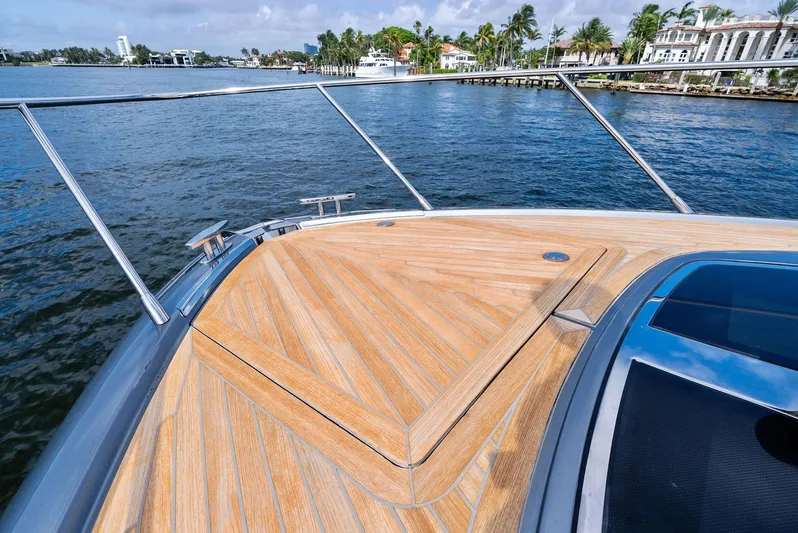 Phantom Yacht Photos Pics Bow of 2019 Riva 56 Rivale yacht with teak decking on a sunny day.