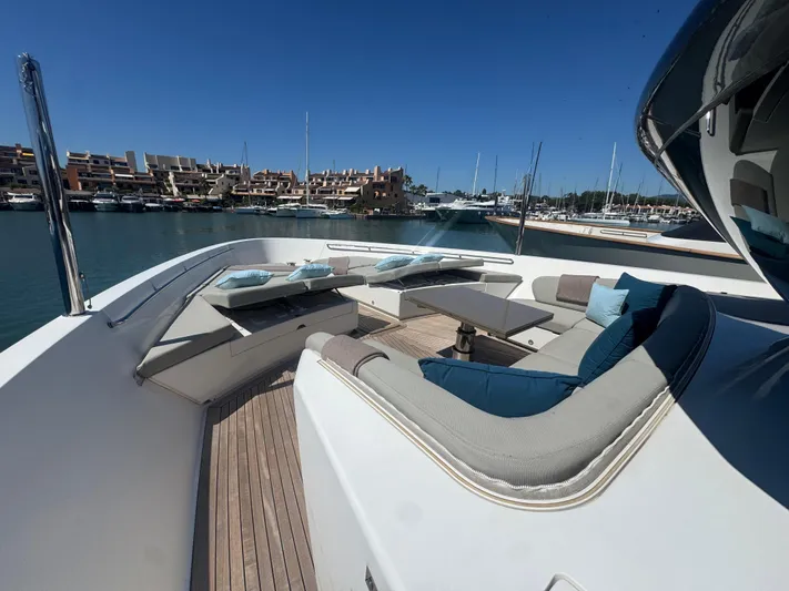  Yacht Photos Pics Luxurious 2018 Sanlorenzo SX88 yacht with elegant outdoor seating area in a marina.