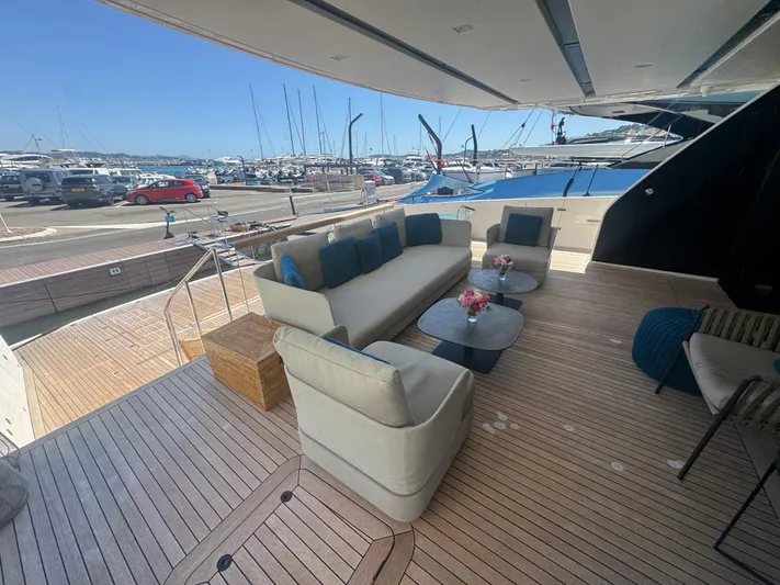  Yacht Photos Pics Luxurious 2018 Sanlorenzo SX88 yacht deck with elegant seating and marina view.