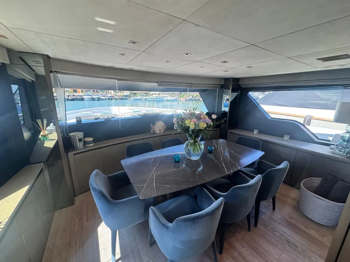  Yacht Photos Pics Luxurious dining area on 2018 Sanlorenzo SX88 yacht with elegant decor and waterfront view.