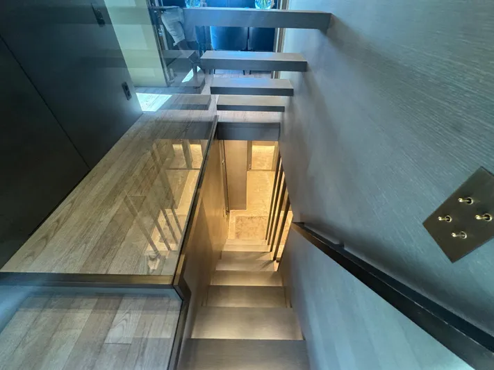  Yacht Photos Pics Interior staircase of 2018 Sanlorenzo SX88 yacht, featuring modern design and wood finishes.