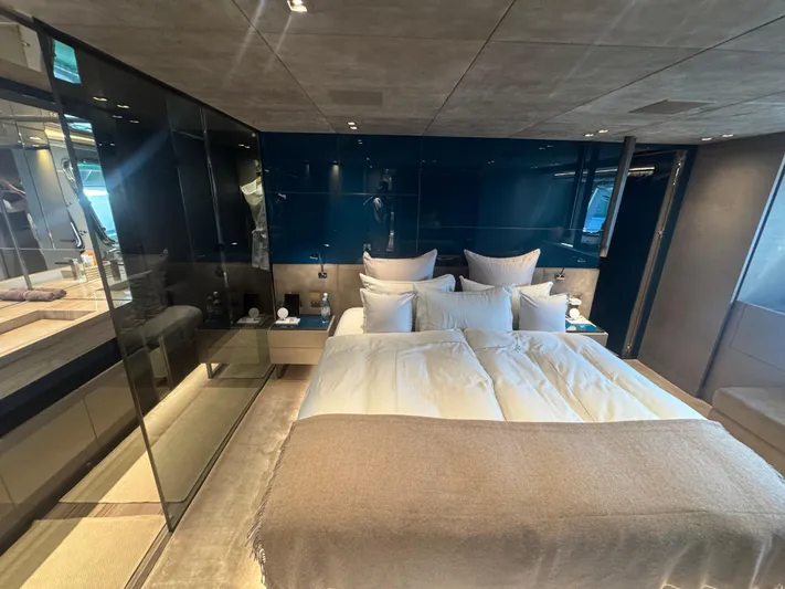  Yacht Photos Pics Luxurious bedroom interior of 2018 Sanlorenzo SX88 yacht with modern design and plush bedding.