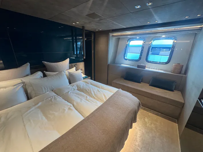  Yacht Photos Pics Luxurious bedroom interior of 2018 Sanlorenzo SX88 yacht with elegant bedding and large windows.