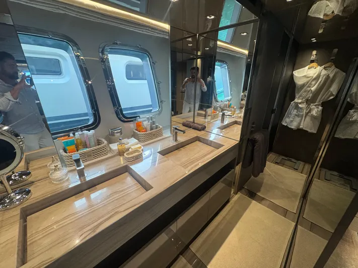  Yacht Photos Pics Luxurious bathroom interior of 2018 Sanlorenzo SX88 yacht with double sinks and elegant decor.