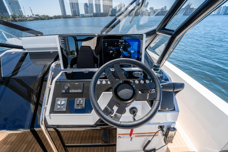  Yacht Photos Pics Helm of 2025 De Antonio Yachts D32 OPEN with modern controls and waterfront view.