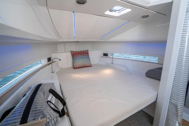 Yacht Photos Pics 2025 De Antonio Yachts D32 OPEN cabin interior with modern design and comfortable bedding.