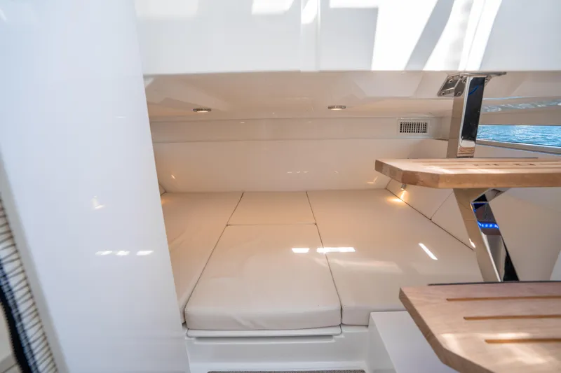  Yacht Photos Pics 2025 De Antonio Yachts D32 OPEN interior cabin with sleek design and wooden accents.