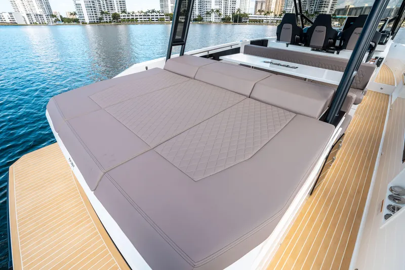  Yacht Photos Pics 2025 De Antonio Yachts D32 OPEN with spacious sunbed, docked on calm water.