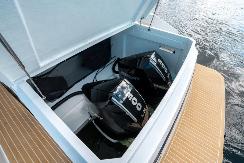  Yacht Photos Pics 2025 De Antonio Yachts D32 OPEN with dual Mercury outboard engines, open engine compartment.