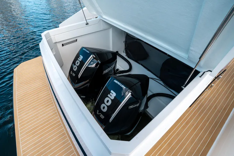  Yacht Photos Pics 2025 De Antonio Yachts D32 OPEN with twin Mercury 300 V8 engines, docked on water.