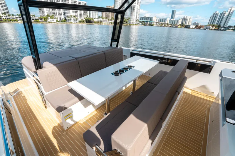  Yacht Photos Pics Luxury seating area on 2025 De Antonio Yachts D32 OPEN, with waterfront city view.