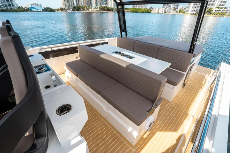  Yacht Photos Pics 2025 De Antonio Yachts D32 OPEN interior with sleek seating and modern design on the water.