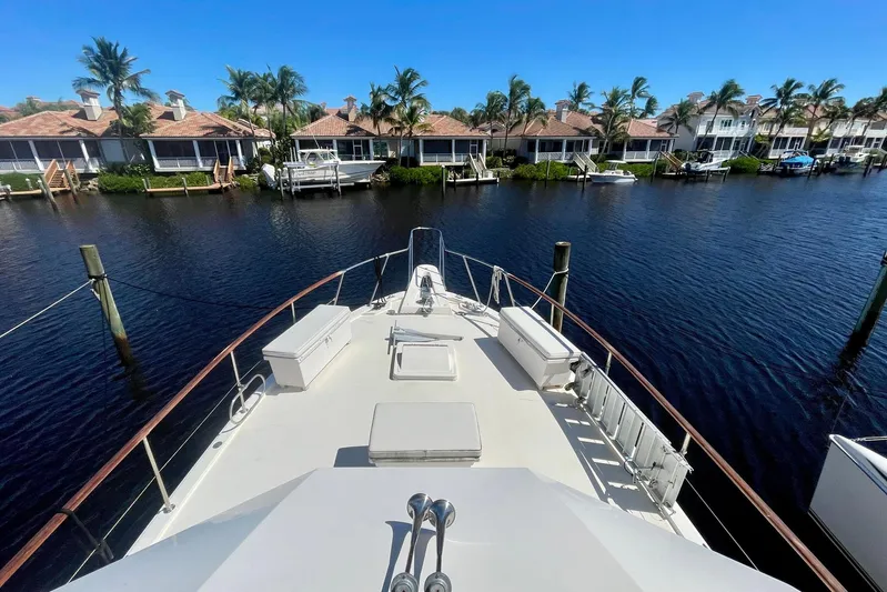 Rubber Ducky Yacht Photos Pics 1981 Hatteras 48 Motor Yacht docked in scenic waterfront neighborhood.