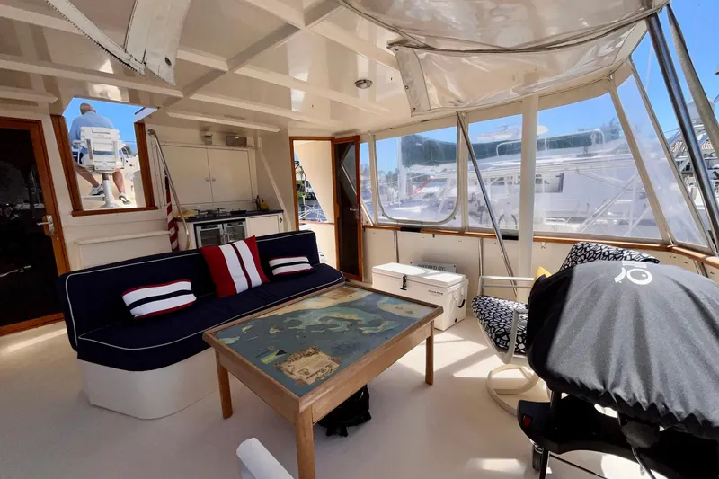 Rubber Ducky Yacht Photos Pics Interior of 1981 Hatteras 48 Motor Yacht with seating and nautical decor.