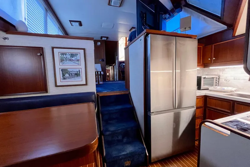 Rubber Ducky Yacht Photos Pics Interior of 1981 Hatteras 48 Motor Yacht with modern kitchen and dining area.