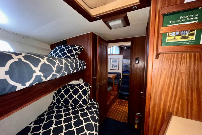 Rubber Ducky Yacht Photos Pics Interior of 1981 Hatteras 48 Motor Yacht with bunk beds and wooden paneling.