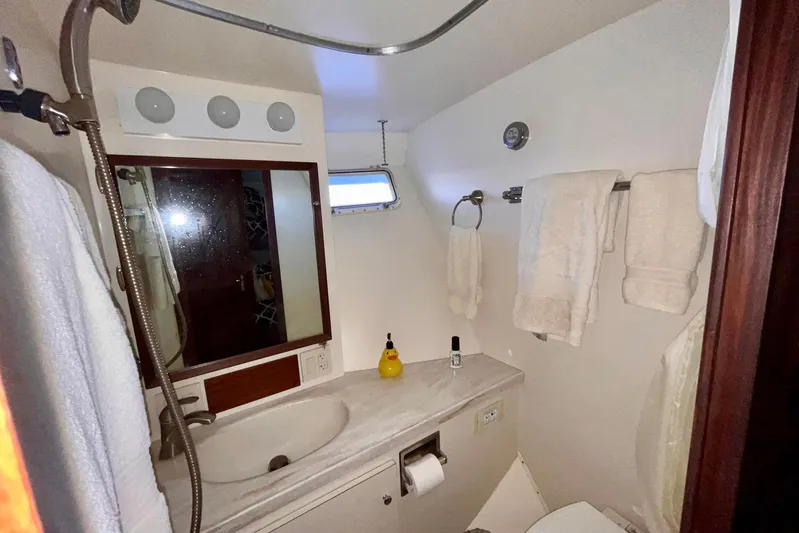 Rubber Ducky Yacht Photos Pics Bathroom interior of 1981 Hatteras 48 Motor Yacht with towels and toiletries.