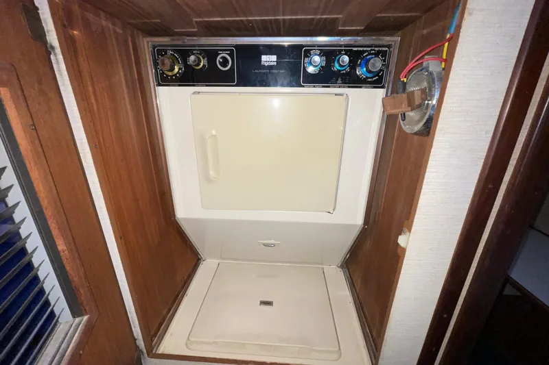 Rubber Ducky Yacht Photos Pics Laundry area with vintage dryer in 1981 Hatteras 48 Motor Yacht.