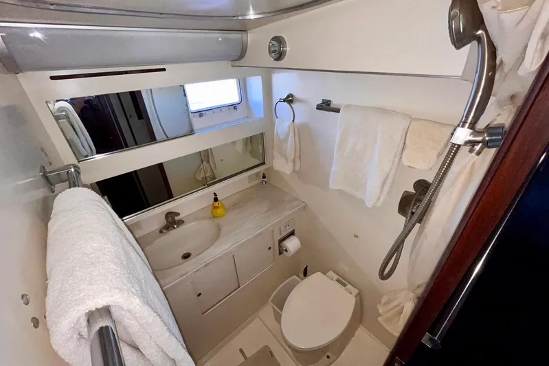 Rubber Ducky Yacht Photos Pics Bathroom of 1981 Hatteras 48 Motor Yacht with sink, toilet, and shower.