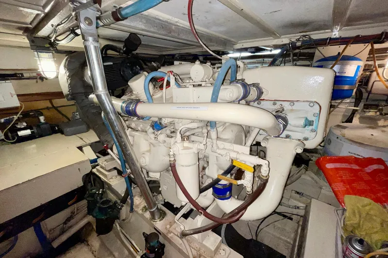 Rubber Ducky Yacht Photos Pics Engine room of a 1981 Hatteras 48 Motor Yacht, showcasing mechanical components.
