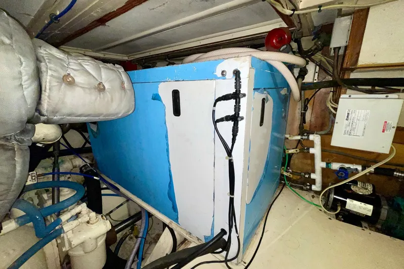 Rubber Ducky Yacht Photos Pics 1981 Hatteras 48 Motor Yacht engine room with blue machinery and wiring.