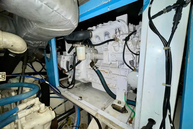 Rubber Ducky Yacht Photos Pics Engine room of 1981 Hatteras 48 Motor Yacht, showcasing mechanical components and wiring.