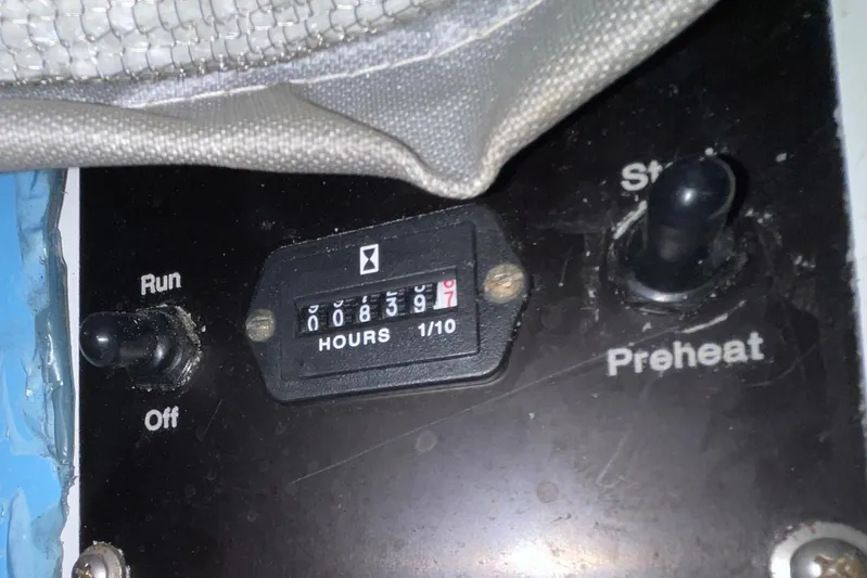 Rubber Ducky Yacht Photos Pics Control panel of a 1981 Hatteras 48 Motor Yacht with hour meter and switches.