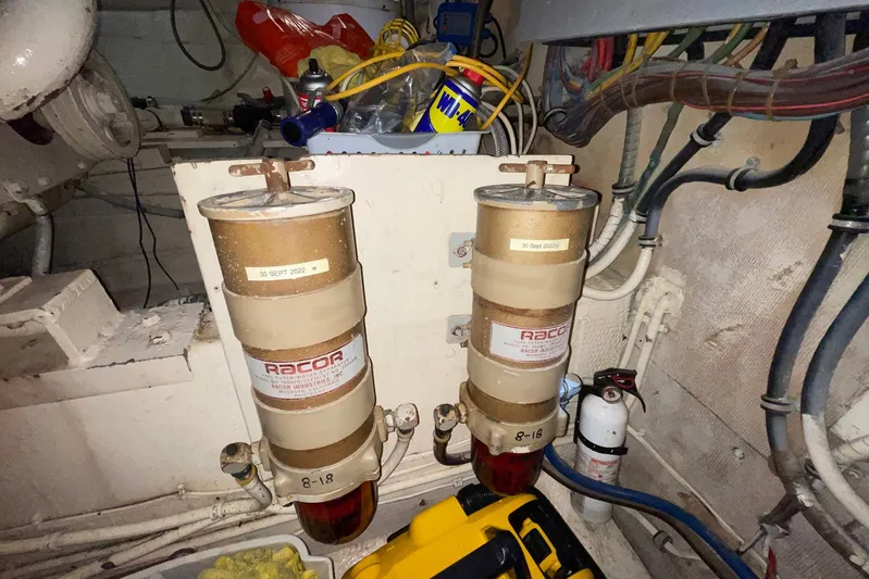 Rubber Ducky Yacht Photos Pics Engine room of 1981 Hatteras 48 Motor Yacht with Racor fuel filters and maintenance tools.