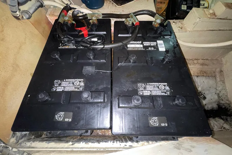 Rubber Ducky Yacht Photos Pics Battery compartment of a 1981 Hatteras 48 Motor Yacht, featuring heavy-duty commercial batteries.