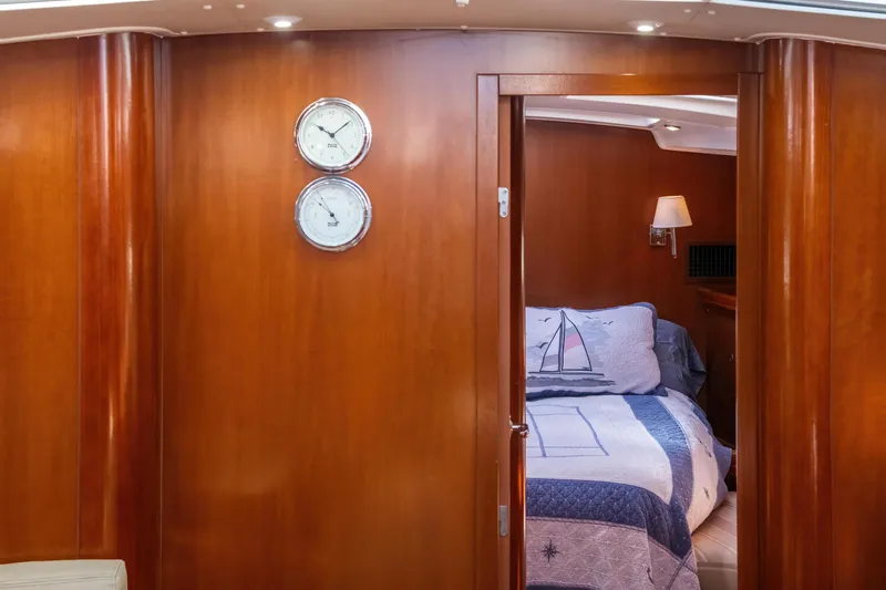  Yacht Photos Pics Interior of 2007 Beneteau Oceanis 523 yacht with cozy bedroom and nautical decor.