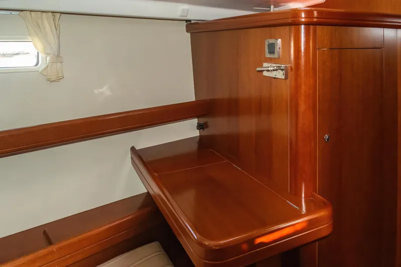  Yacht Photos Pics Interior of 2007 Beneteau Oceanis 523 yacht with polished wood finish and compact design.