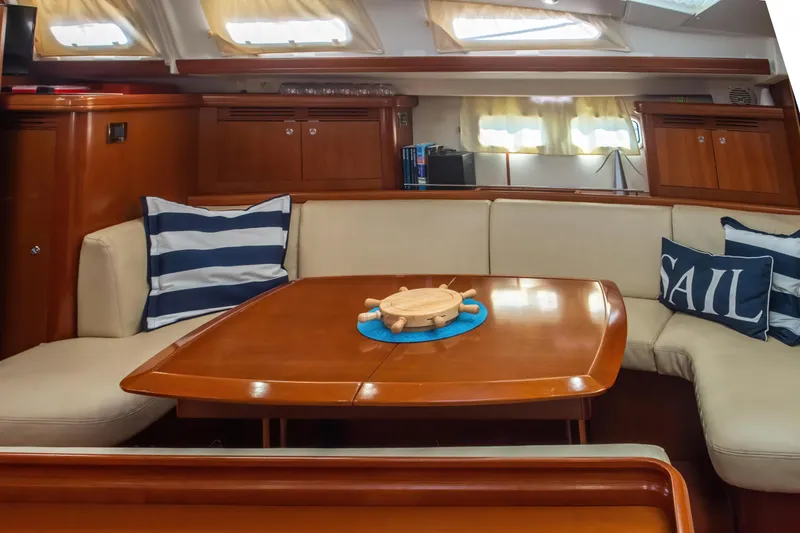  Yacht Photos Pics Interior of 2007 Beneteau Oceanis 523 yacht with cozy seating and nautical decor.