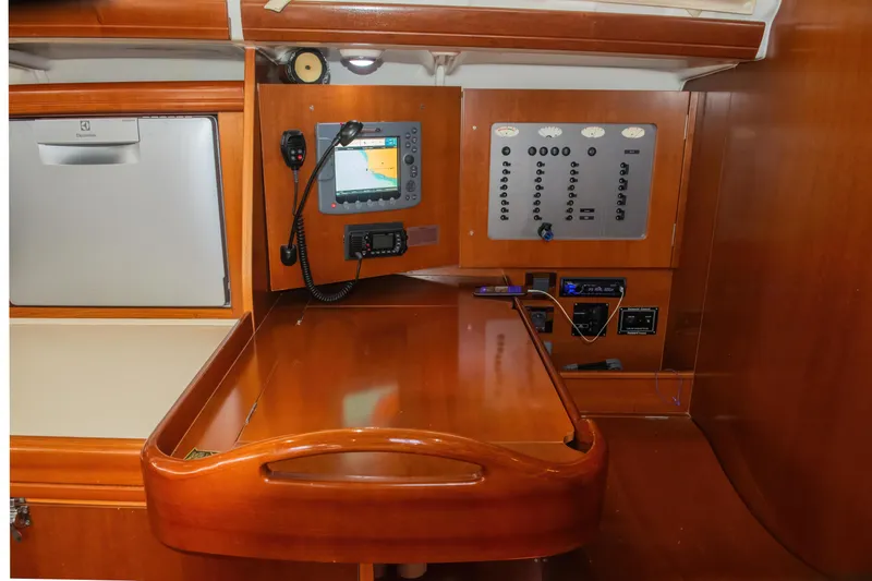  Yacht Photos Pics Navigation station of 2007 Beneteau Oceanis 523 yacht with control panel and equipment.