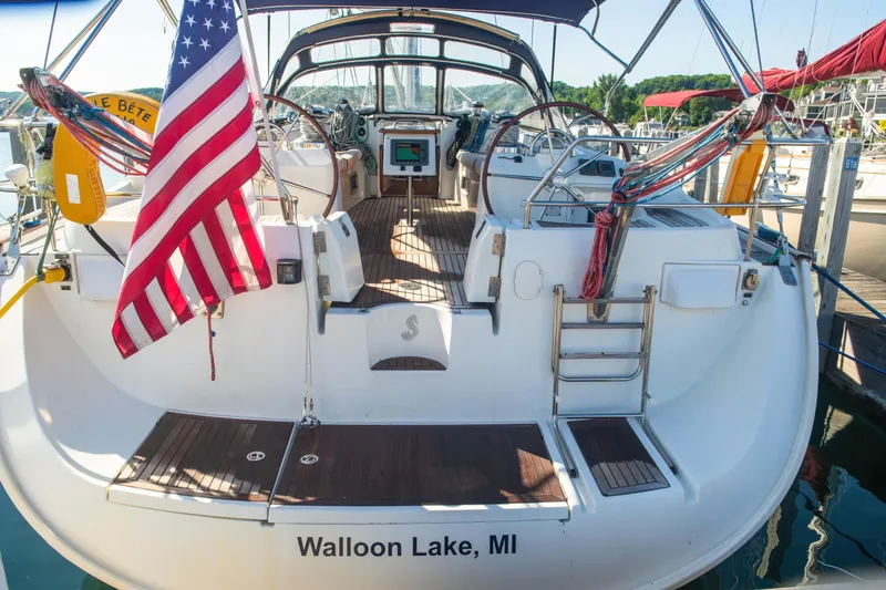  Yacht Photos Pics Beneteau Oceanis 523 sailboat, 2007 model, docked at Walloon Lake, MI, with American flag.