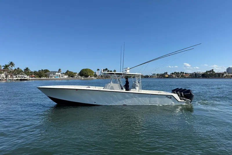  Yacht Photos Pics 2018 SeaVee 390Z boat on calm water, clear sky, coastal background.