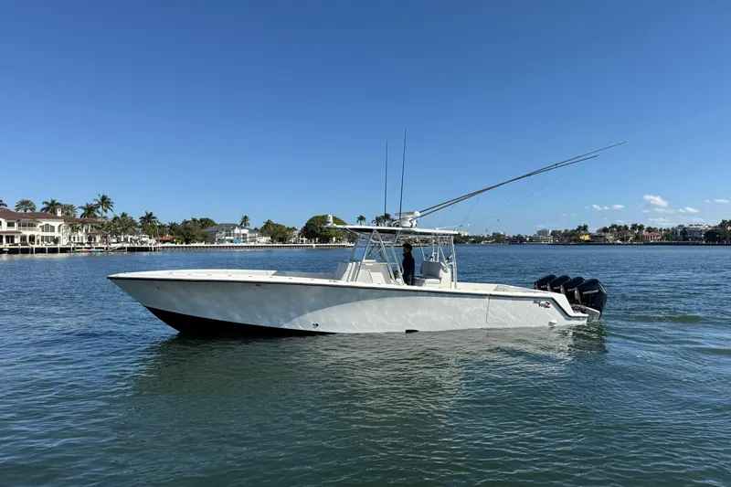  Yacht Photos Pics 2018 SeaVee 390Z boat on calm water, clear sky, coastal background.