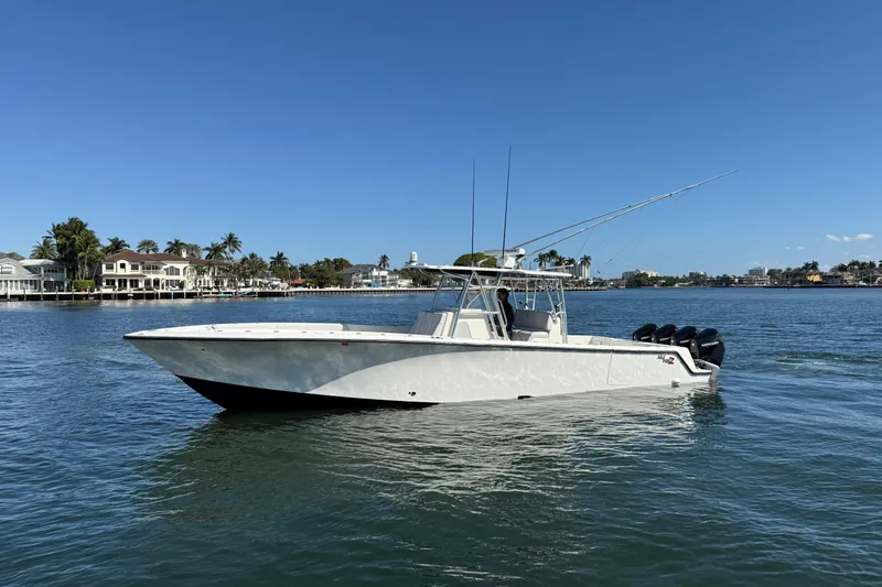  Yacht Photos Pics 2018 SeaVee 390Z boat on calm water, clear sky, coastal background.