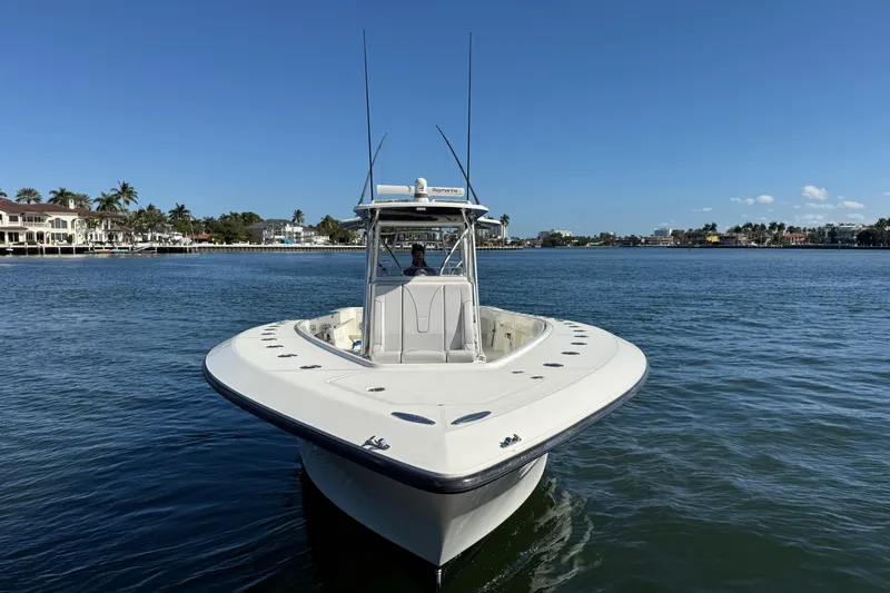  Yacht Photos Pics 2018 SeaVee 390Z boat on calm water with coastal homes in the background.