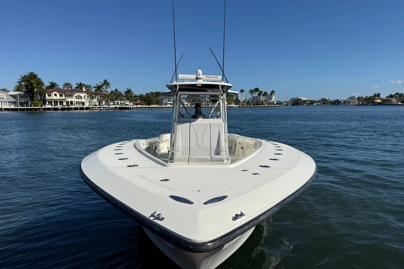  Yacht Photos Pics 2018 SeaVee 390Z boat on calm water with coastal homes in the background.