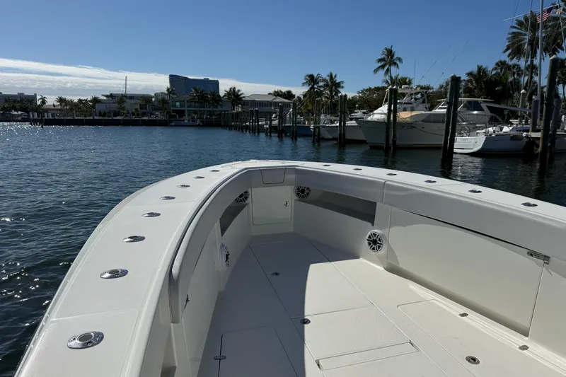  Yacht Photos Pics 2018 SeaVee 390Z boat docked in a sunny marina with palm trees.