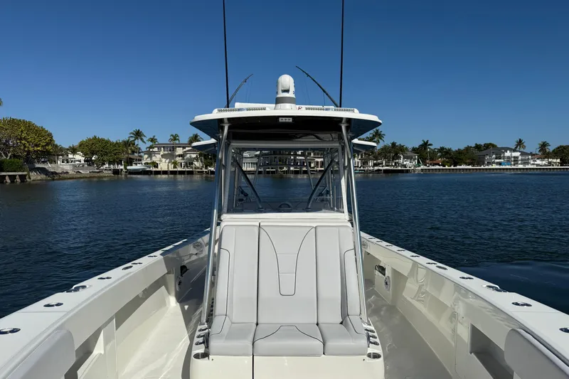  Yacht Photos Pics 2018 SeaVee 390Z boat on calm water, showcasing sleek design and spacious deck.
