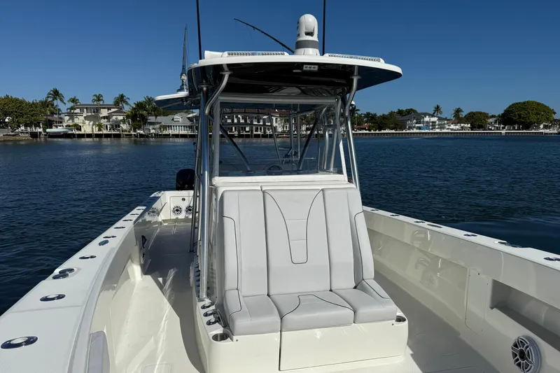  Yacht Photos Pics 2018 SeaVee 390Z boat on calm water, featuring sleek design and spacious seating.