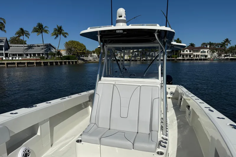  Yacht Photos Pics 2018 SeaVee 390Z boat on calm water, featuring sleek design and spacious seating.